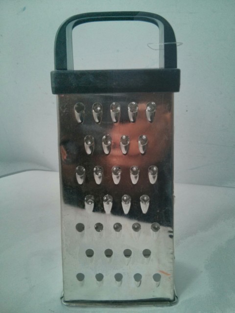 grater used to grate carrot for moist carrot cake