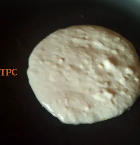 buttermilk pancake frying in a pan
