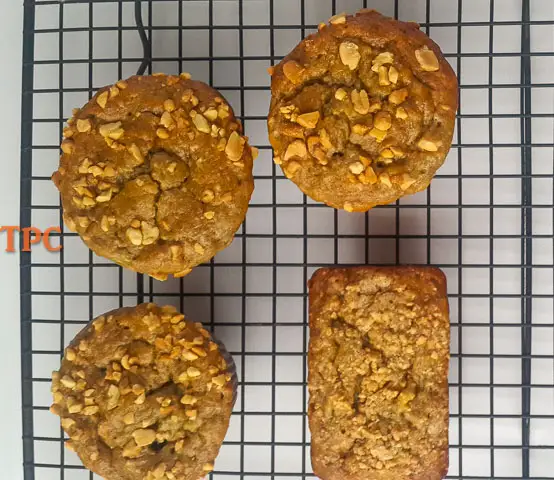  banana bread/banana muffin straight out of the oven, sprinkled with nuts
