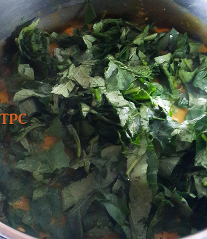 shredded anala leaves in the pot of anala soup, ofe ukpom