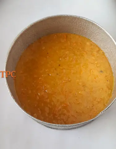 moist carrot cake batter in a pan