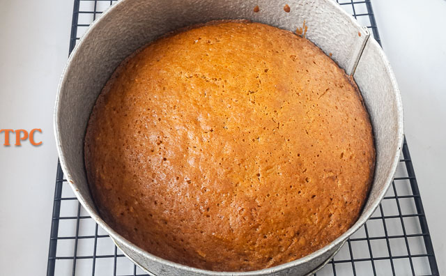 moist carrot cake in a cake pan, looking delish