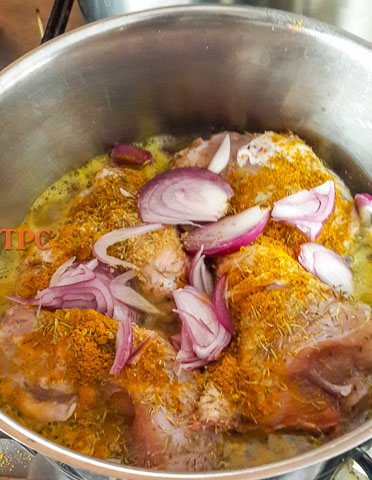 spiced chicken boiling for use in nigerian tomato stew