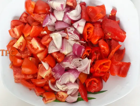 chopped tomato, onions and peppers ready for grinding for Nigerian tomato stew base