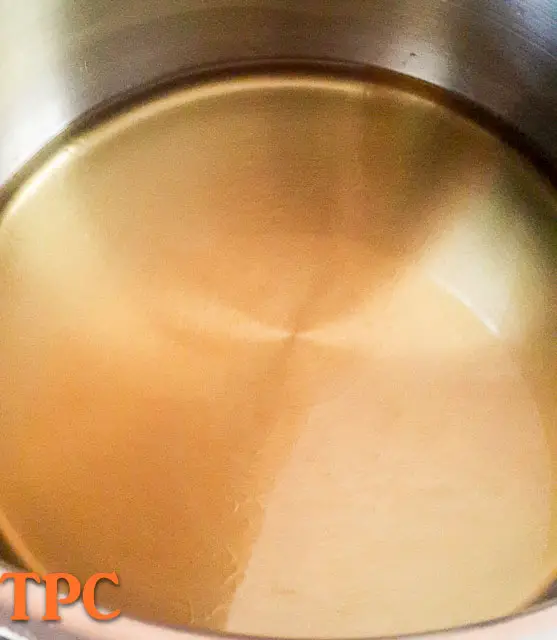vegetable oil in pot for nigerian tomato stew base