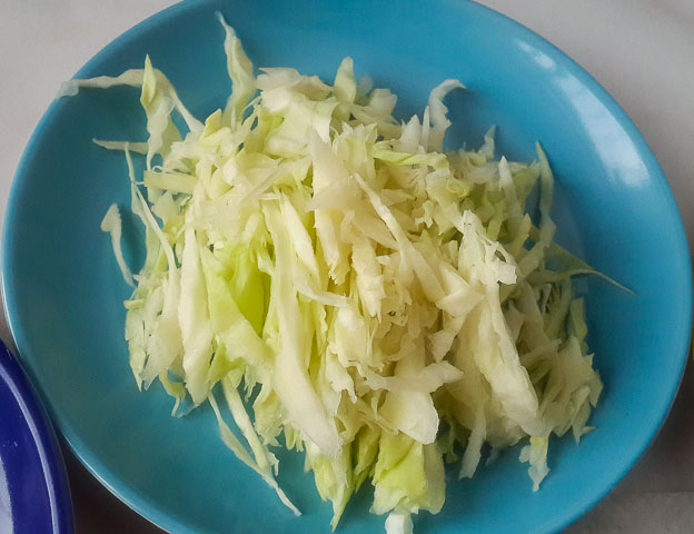 sliced cabbage for beetroot coleslaw