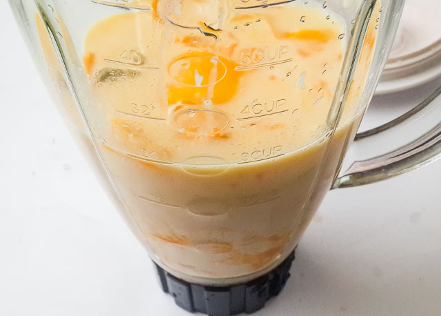 mango lassi ingredients in a blender