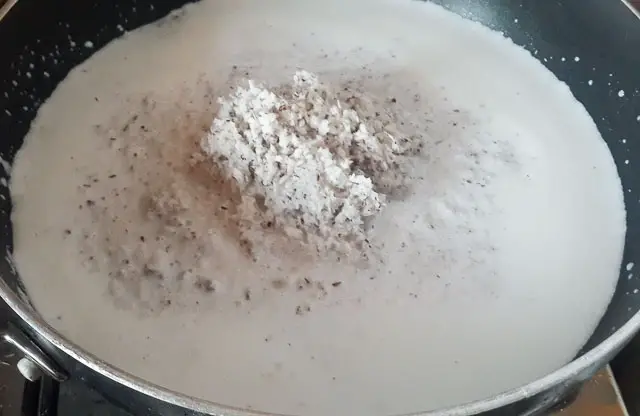 shredded coconut in coconut milk for Indian coconut ladoo