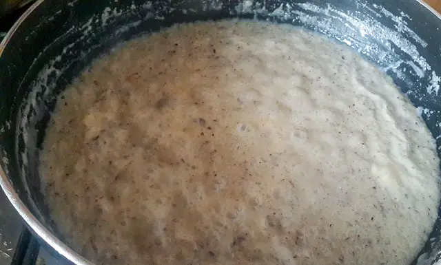 Indian coconut ladoo bubbling in sauce pan