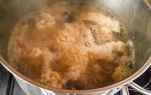 pounded yam in pot of nsala soup 