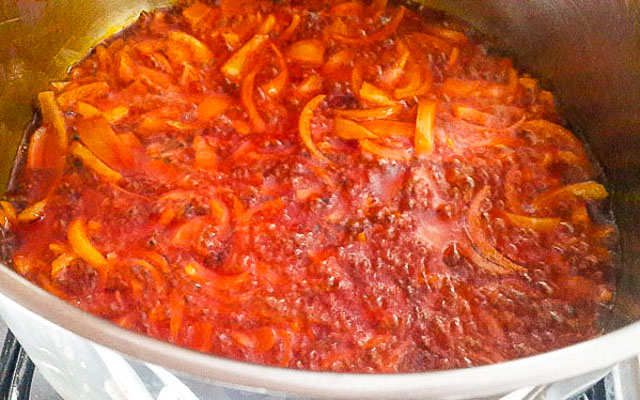 sliced onions frying in palm oil for native stew-1