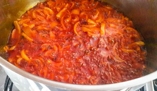 onions frying for Efo riro (vegetable soup)