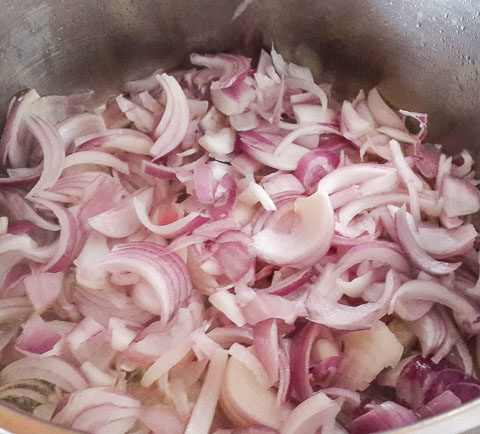 sliced onions for Nigerian Coconut Rice