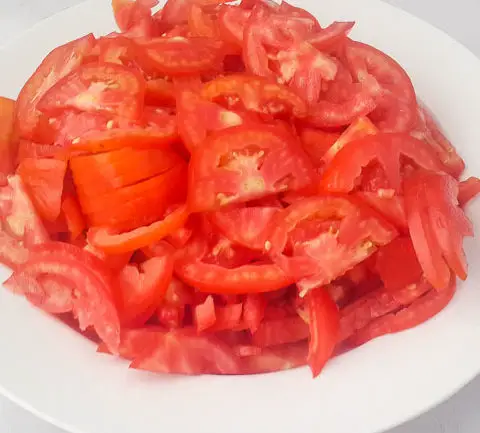 sliced tomatoes for Nigerian Coconut Rice