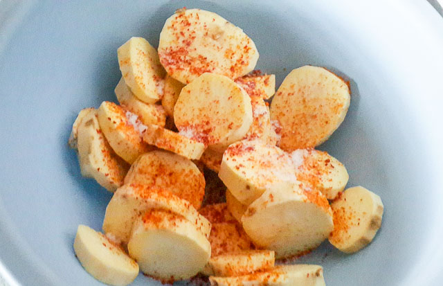 sweet potato discs with salt and pepper for Roasted Sweet Potatoes 