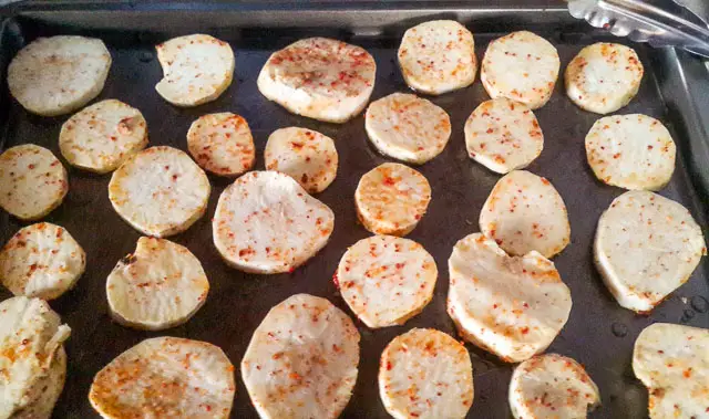 sweet potato discs in roasting pan for Roasted Sweet Potatoes 