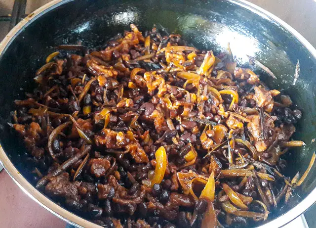 achicha, dry cocoyam in a saucepan