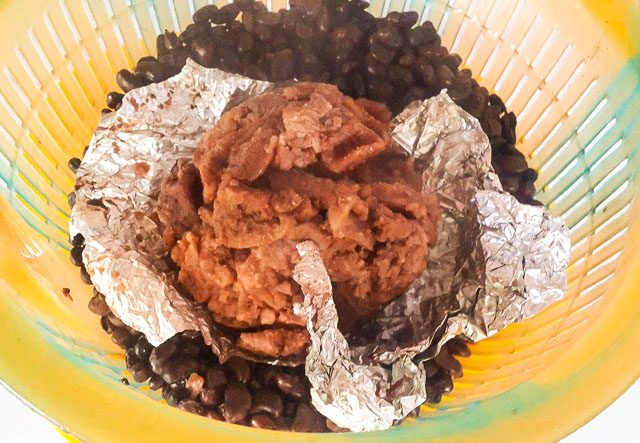 unwrapped achicha in foil for achicha, dry cocoyam