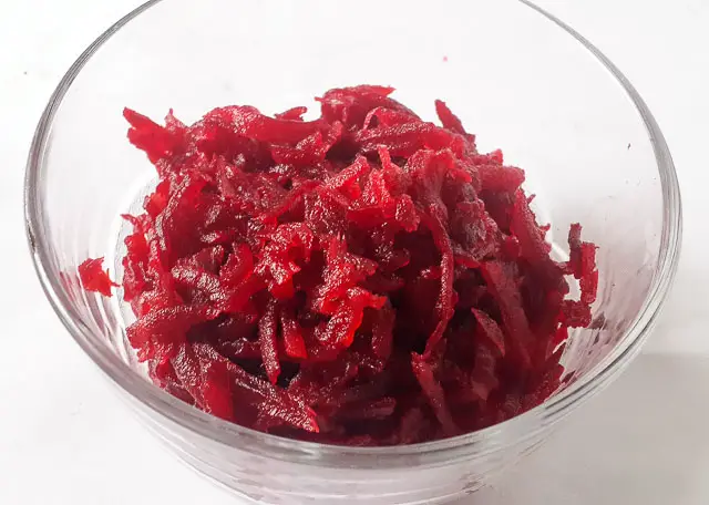grated beetroot for Healthy beetroot cake batter in loaf tin