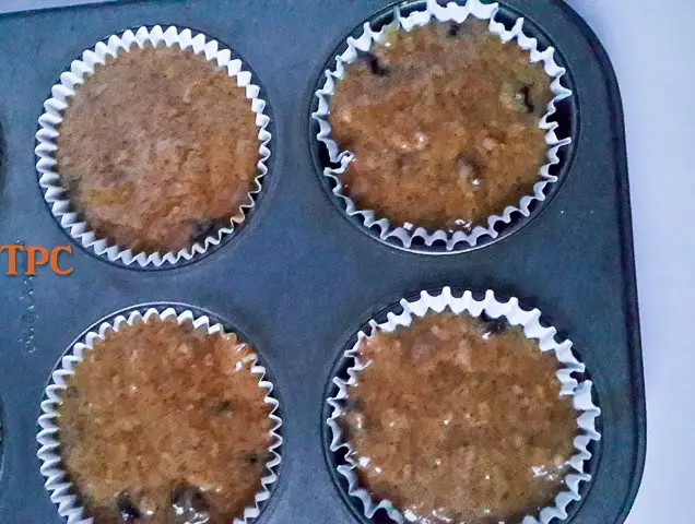cinnamon muffin batter in muffin tin