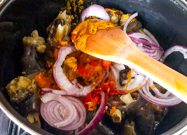 homework, goat trotters being stirred in a pot