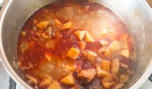 plantains porridge boiling in a pot
