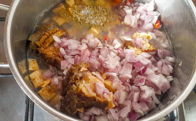 cubed plantains with other ingredients in a pot for plantains porridge