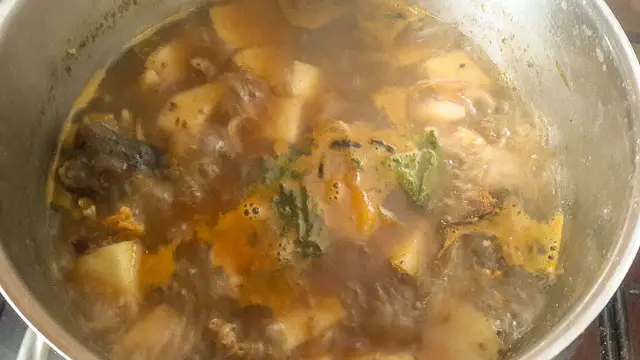 yam pepper soup boiling in a pot