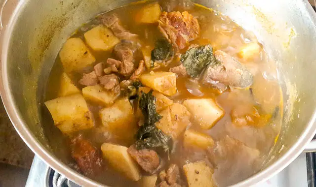 yam pepper soup boiling in a pot