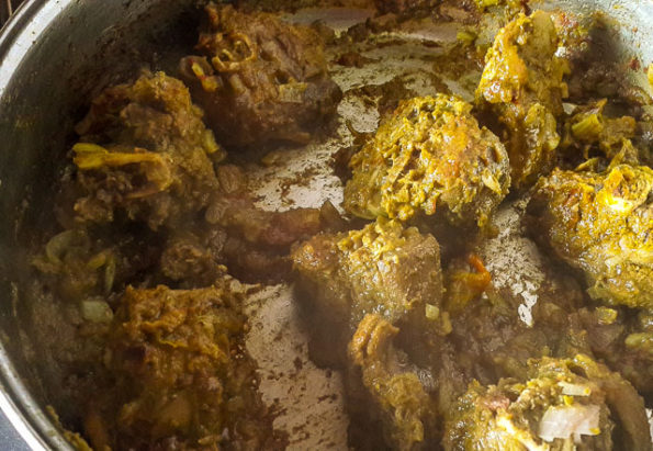 Jamaican goat curry getting ready in a pot