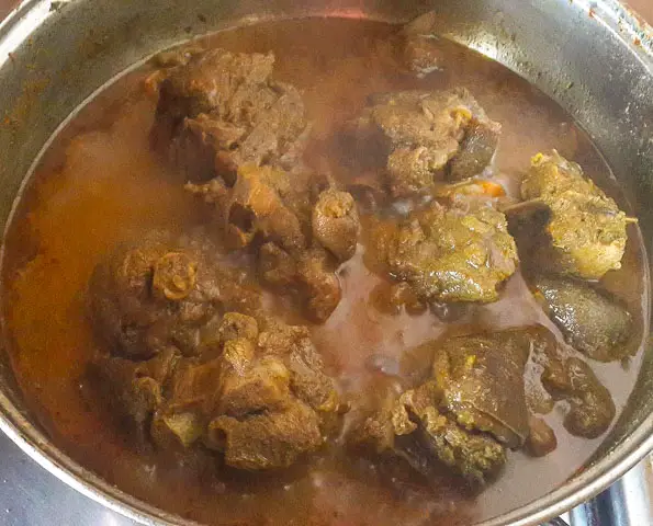  Jamaican goat curry getting ready in a pot