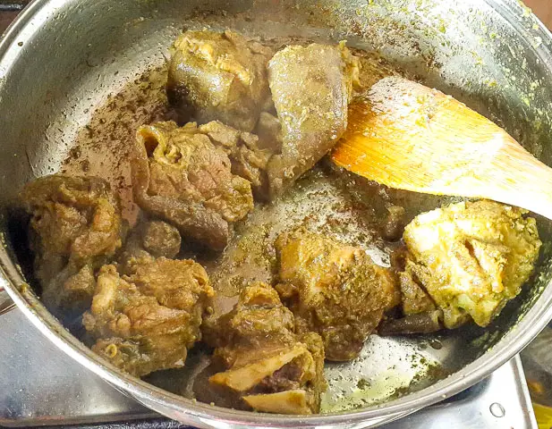 goat neat being fried for Jamaican goat curry 