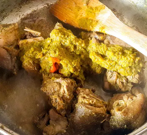 Jamaican goat curry getting ready in a pot
