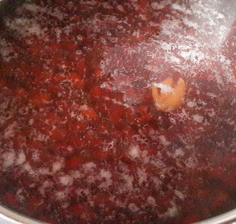 red kidney beans boiling in a pot for Jamaican rice and peas