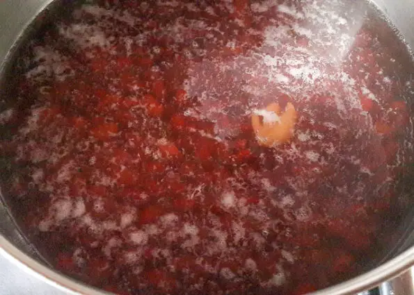 red kidney beans boiling in a pot for Jamaican rice and peas