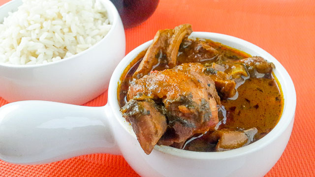 Ofe akwu with herbs and rice