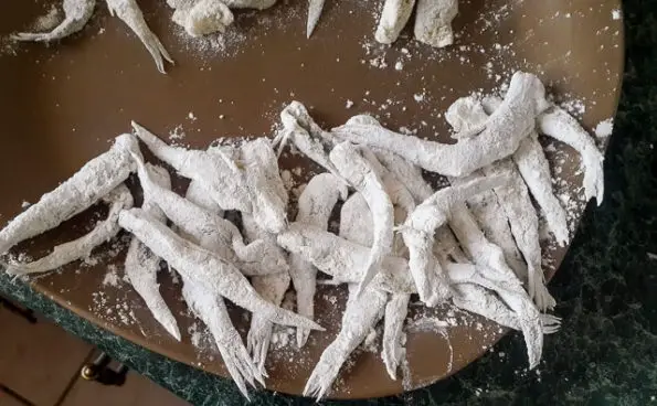 white bait drenched in flour for Nigerian crispy fried whitebait fish