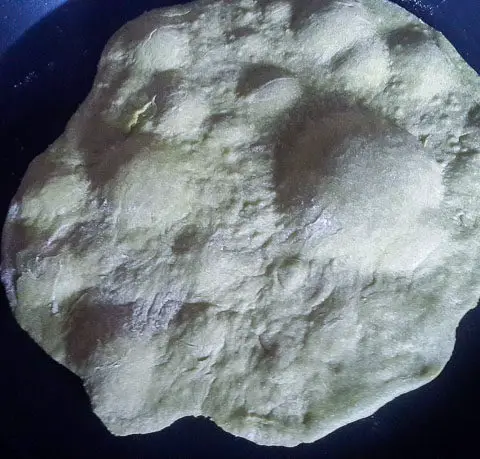 East african chapati dough with bubbles showing bubbl