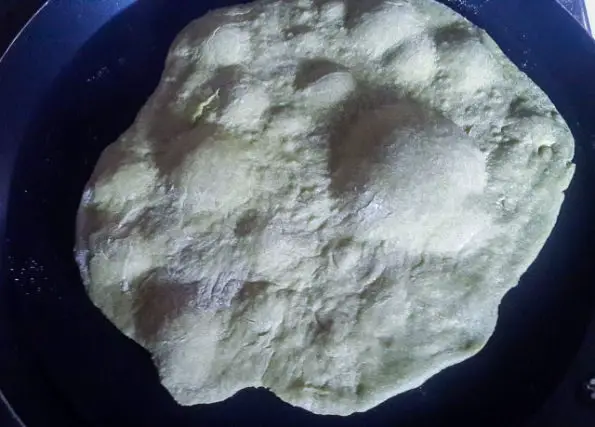 East african chapati dough with bubbles showing bubbl