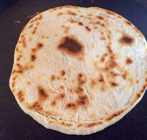 East african chapati dough in a crepe pan