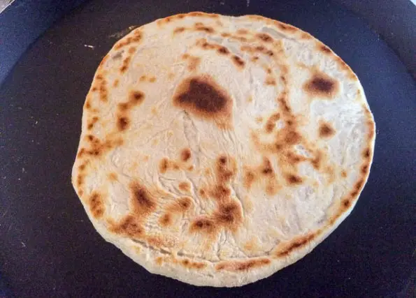 East african chapati dough in a crepe pan