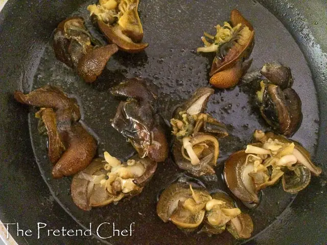 snails frying for Nigerian peppered snail