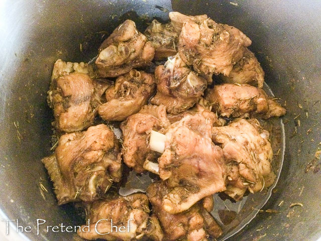 Meat boiling in a pot for Nigerian stir fried rice