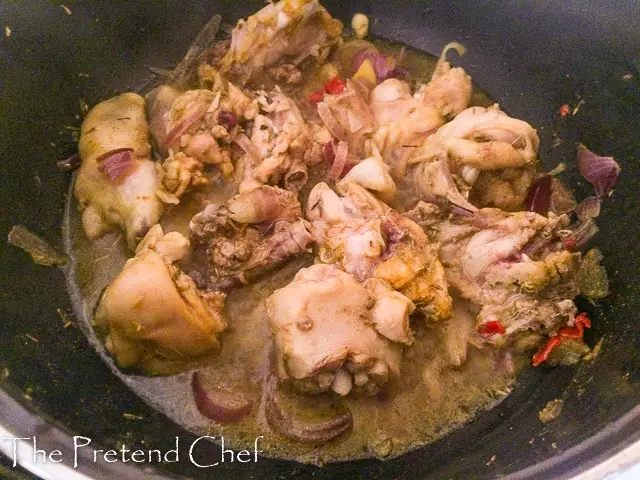 chicken spiced and cooking in a pot for Easy Nigerian vegetable sauce