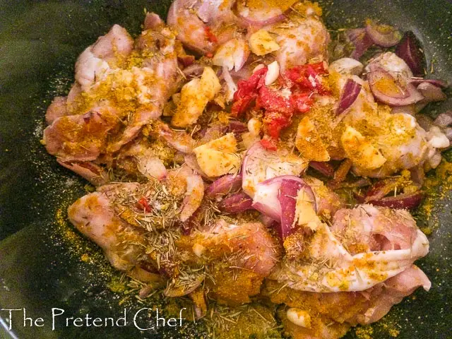 Chicken in a pot spiced, ready to be cooked for Easy Nigerian vegetable sauce