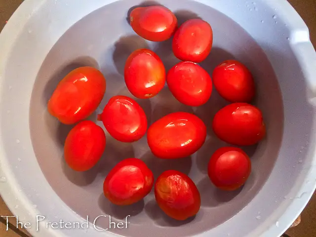 whole tomatoes immersed in ice cold water for how to blanch vegetables