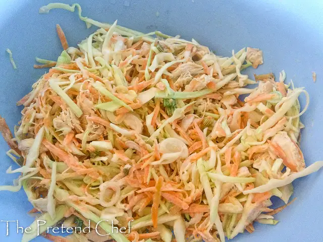 chicken salad with candied carrot coins in a bowl