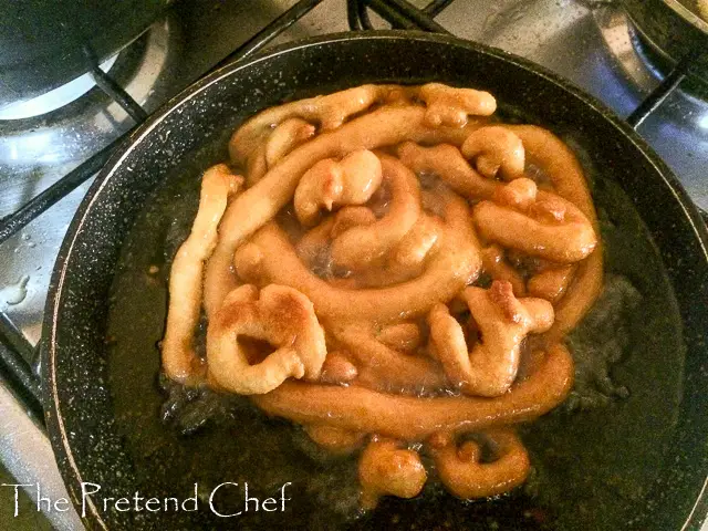 Light, chewy, crunchy, not too sweet funnel cake frying in frying pan