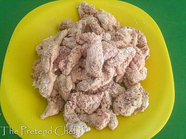 shredded beef drenched in flour for mongolian beef stir fry