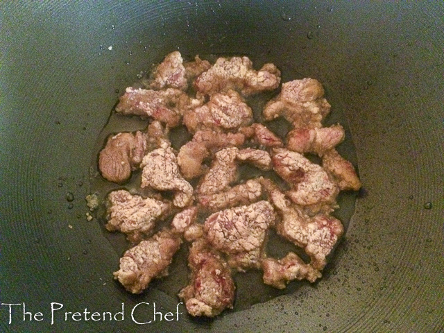 shredded beef frying for mongolian beef stir fry